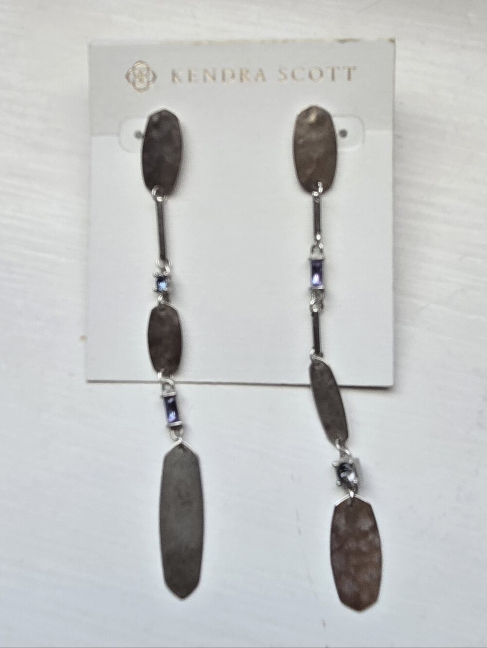 Kendra Scott linear dangle earrings featuring alternating metal links and small